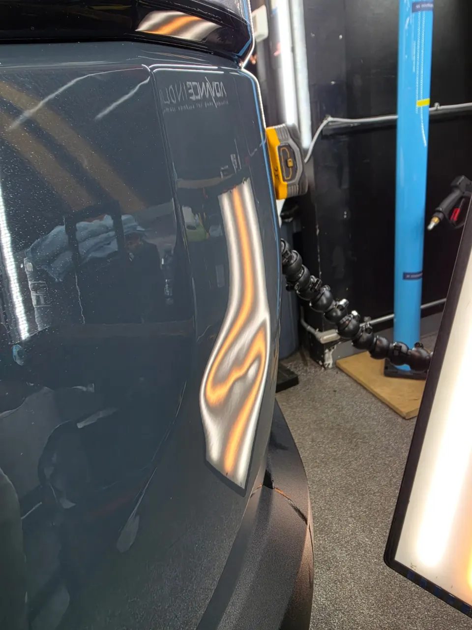 Quarter panel dent before repair